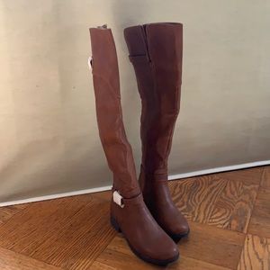 Brown faux leather boots.